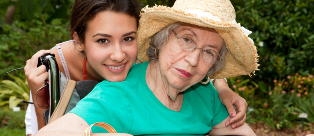 caregiver hugging patient from the back