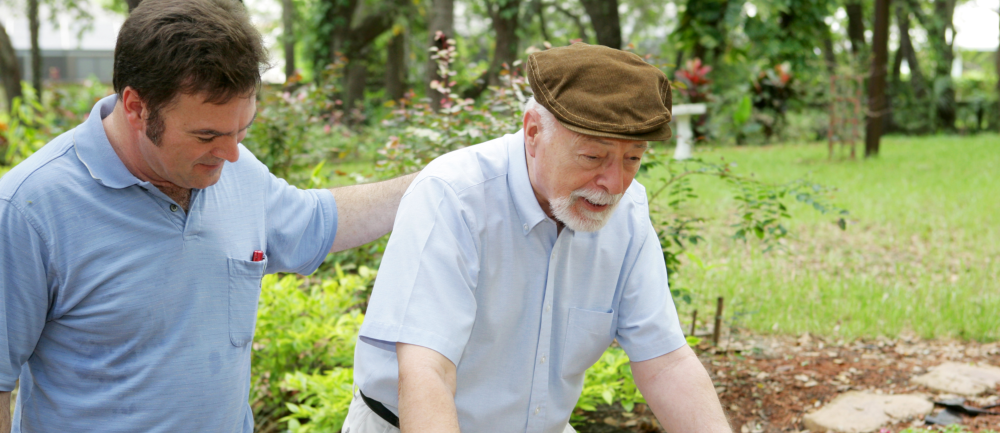 caregiver assisting patient in walking